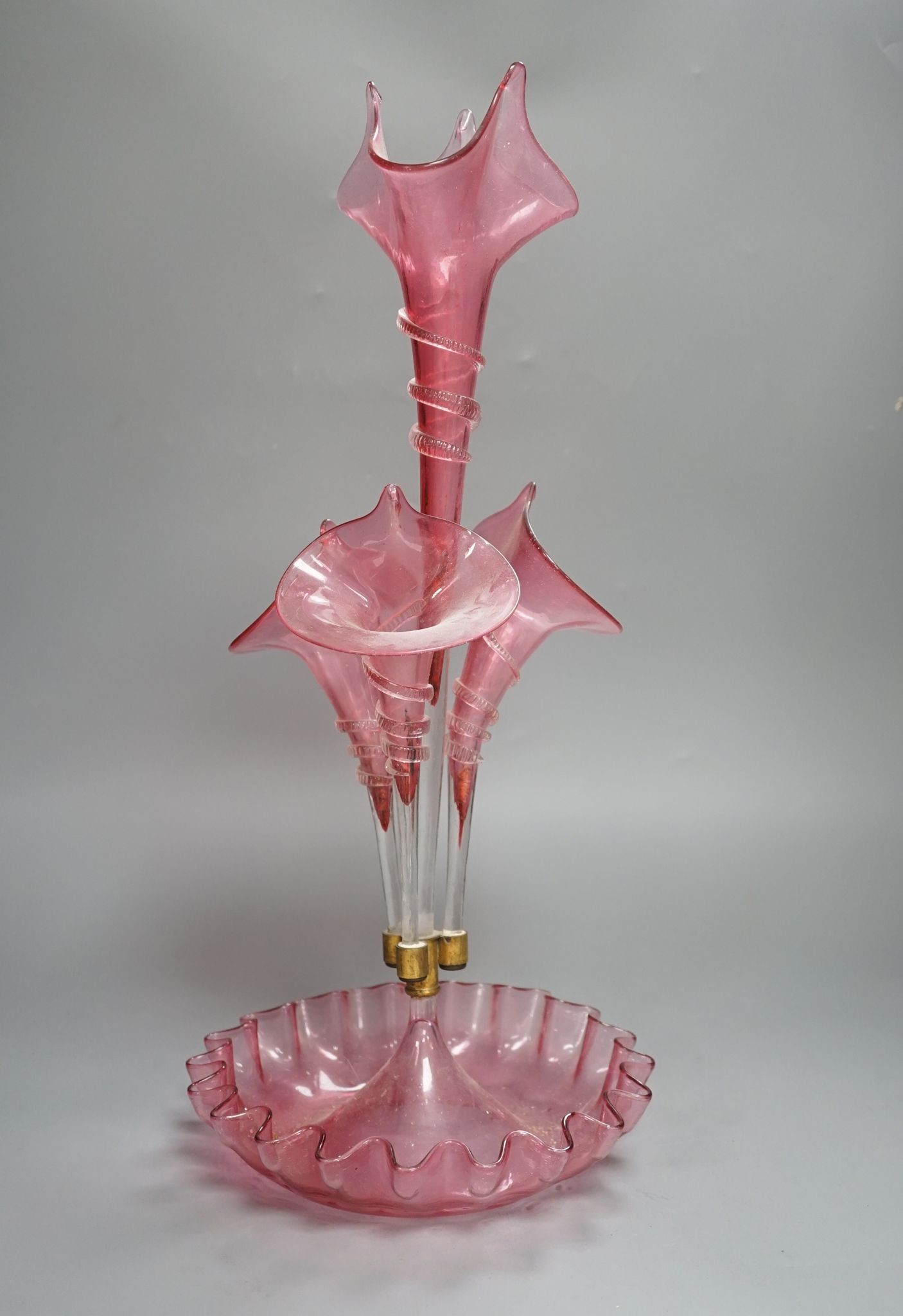 A Victorian cranberry glass four vase table centrepiece, 52 cms high.
